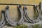 Background surface of very old and rusty horseshoes placed near the wall
