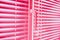 Background sweet pink closed horizontal shutters closeup