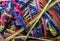 background of a tangle of multicolored yarn threads of different colors and thicknesses