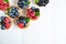 Background with tartlets. Berry tartlets with space for copy space. Cupcakes with raspberries, blueberries and blueberries on a