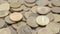 Background of ten-ruble coins on the surface close-up. Macro shot of Russian green coins