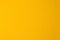 Background texture of a blank sheet of yellow paper.