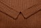 Background texture of brown knitted wool fabric
