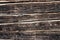 Background - the texture of burnt logs of the wall of a wooden house. Burnt wood charred texture of a log house. close-up. The