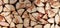 Background texture from chopped quarters of firewood stacked together