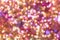 Background texture full of unsharp golden and pink shining bokeh blurring gradation design.