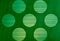 Background texture gradations and circle pattern on green plastic