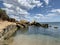 Background texture: large stones of various shapes in the sea. A pile of granite boulders against the background of the sea and