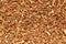 Background texture of loose tobacco a small dirty brown loose dry grass