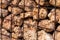 Background and texture of many rough stones in a metal cage forming a wall with selective focus