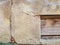 Background texture old broken plastered stone wall and wooden boards