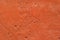 Background, texture: orange roughly plastered wall