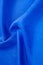 Background texture, pattern. Thick thick silk fabric of blue col