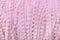 background texture of a plush thread with pompons. delicate pink color.