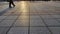 Background and texture of tiles on the sidewalk and sun in sunset. The sidewalk on the street is made of pieces of tile