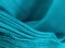 Background texture of turquoise polyester fabric