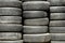 Background texture of used, dirty car tyre stacks