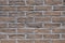Background of texture wall from new bricks of brown color
