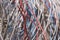 Background texture of white, red and blue tangled wire.