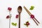 Background texture wooden spoon, wooden chopsticks and colorful pink red flowers cosmos arrangement flat lay style