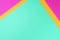 Background in trendy green, pink and yellow colors. Fashionable paper. Top view. Minimal concept. Trendy mint color