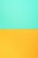 Background in trendy green and yellow colors. Fashionable paper. Top view. Minimal concept. Trendy mint color