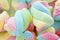 Background of twisted, colorful marshmallow, close up, macro