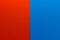 Background of two vertical rectangles red and blue. Sheets of blank red and blue paper with fine texture, split vertically, close