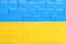 Background Ukraine Flag brick wall, childish cubes. Bright toys, illustration