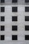 Background from an unfinished building with window openings, from cinder block and floor slabs