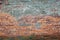 background urban orange brick wall with cement patch and cracks