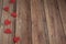 Background for Valentine`s Day. Garland of hearts on a wooden background. Valentine