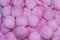 Background from a variety of pink pompons
