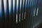Background of vertical metallic bars of bluish tones