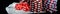 Background vertical rows of different poker chips and red dice stand on paper money long photo