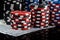Background vertical rows of different poker chips stand on paper money