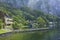 Background view of the beautiful shores of Lake Traunsee with trees and villas, Austria