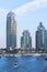 Background view of skyscrapers and the Persian Gulf at the entrance to Dubai Marina