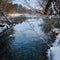 background view of the unfrozen winter lake