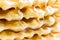 Background of waffles, Patterned cookies, sprinkled with honey and raspberries. Selective focus.