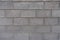Background - wall made of gray concrete masonry units