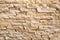 The background of the wall is made of natural granite strips of Sunny beige color with a beautiful stone pattern. Backgrounds