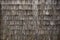 Background wall of rough weathered grey cedar shakes shingles