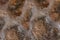 Background wall stone brown base urban weathered close-up texture stone rough surface
