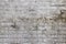 Background weathered brick wall with white plastering