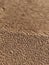 Background of wet sand with pores. Beach sand seamless pattern.