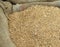 Background of wheat seeds in a sack of jute after harvest