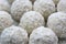 Background of white sweet balls with coconut