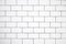 A background of white tile similar to a brick,