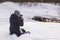 Background winter landscape girl in the snow photographing nature